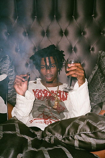Download Playboi Carti showin off his cool style even while just  checking his phone Wallpaper  Wallpaperscom
