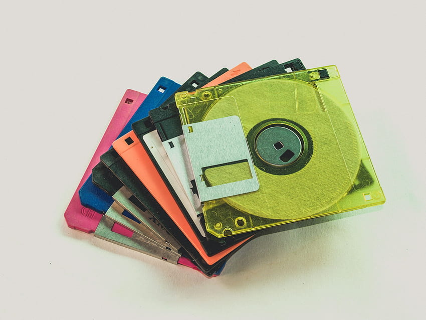 Floppy Disk Lot on White Surface · Stock HD wallpaper