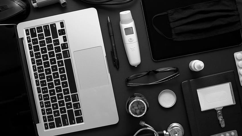 Doctor concept. Various medical tools and accessories placed on black backgrounds table as a mockup. With laptop, medicine, stethoscope, pressure gauge, thermometer. Flat lay, top view. Stock Video Footage HD wallpaper