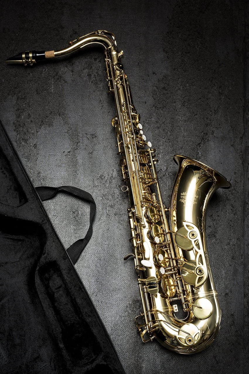 Brass Saxophone on Gray Table Near Black Bag · Stock HD phone wallpaper