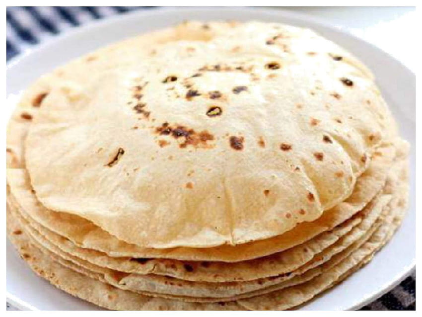 AI generated Chapati on wooden background, representing authentic Indian  traditional cuisine 36117460 Stock Photo at Vecteezy