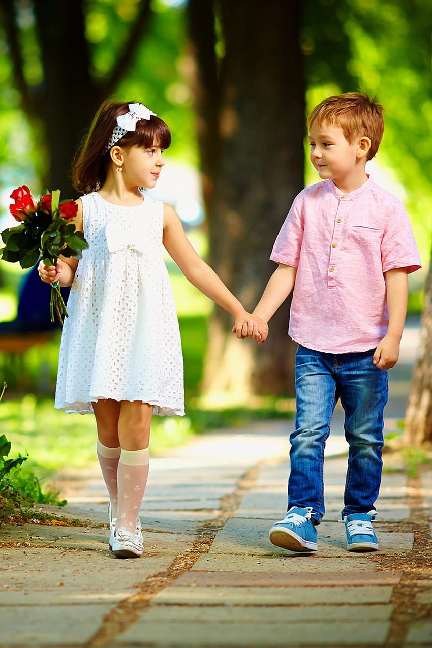 cute baby couple holding hands