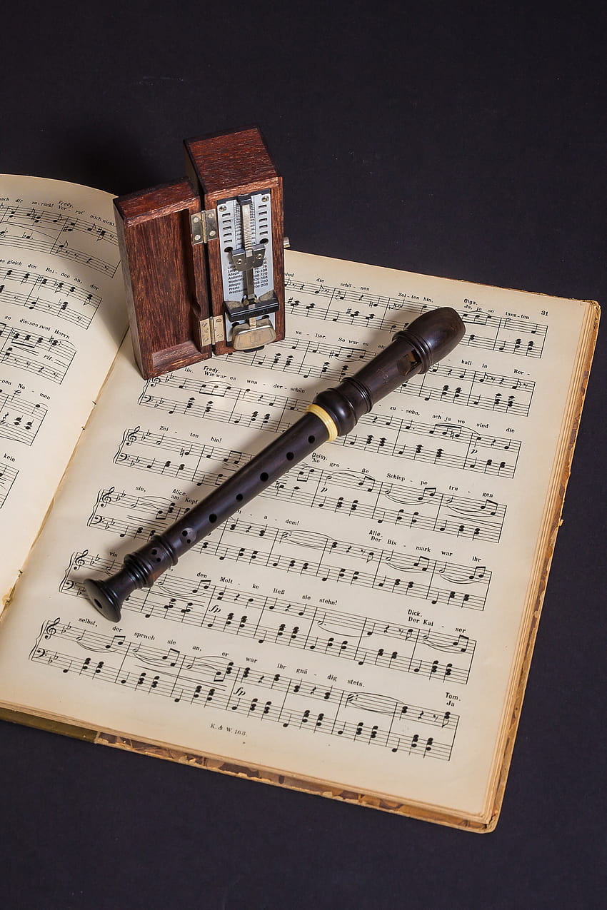 Brown Wooden Flute on Book With Notes · Stock HD phone wallpaper