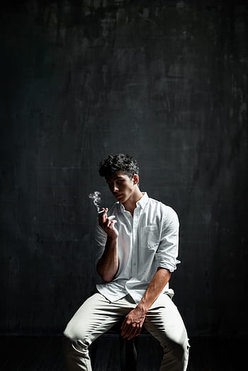 Image of Portrait of Attractive Indian Male Model With an Expression Over  an Black Background-DR290612-Picxy