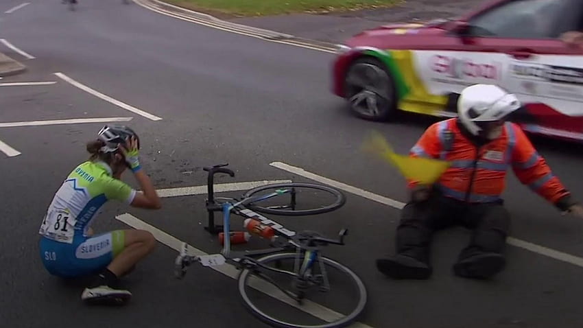Road World Championships: Marshal gives rider helping hand after collision HD wallpaper