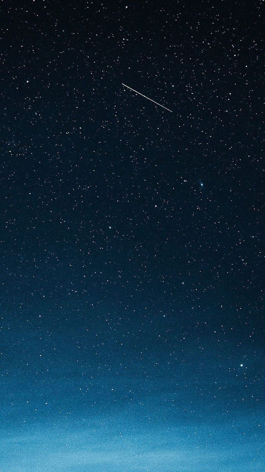 Estrella fugaz en el cielo azul oscuro sobre Groenlandia, estrella fugaz sobre el planeta fondo de pantalla del teléfono
