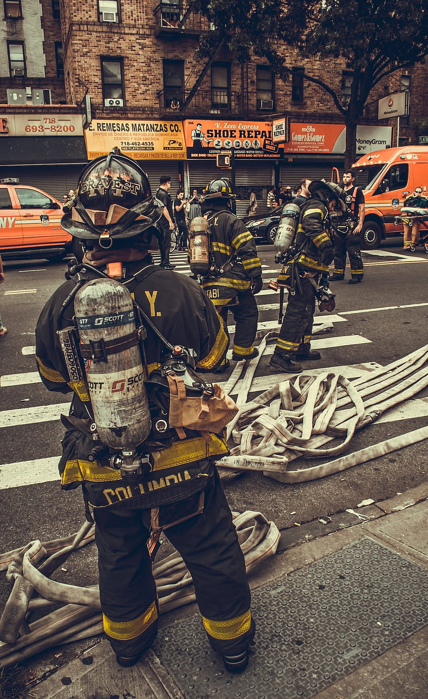 Download Fire Department Officer In A Flaming Building Wallpaper |  Wallpapers.com