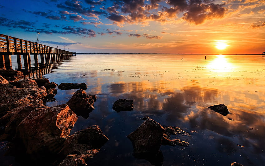 Coast sunset landscape, sea, pier, wooden bridge, rocks, sunset bridge sea rocks clouds HD wallpaper