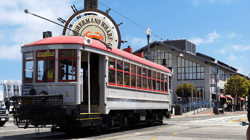 a cable car travels past the famous fisherman's wharf district of, fishermans wharf HD wallpaper