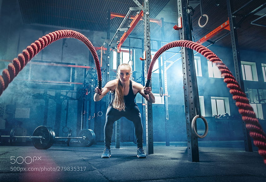 Woman with battle ropes exercise in the fitness gym. Woman with, women battle rope HD wallpaper