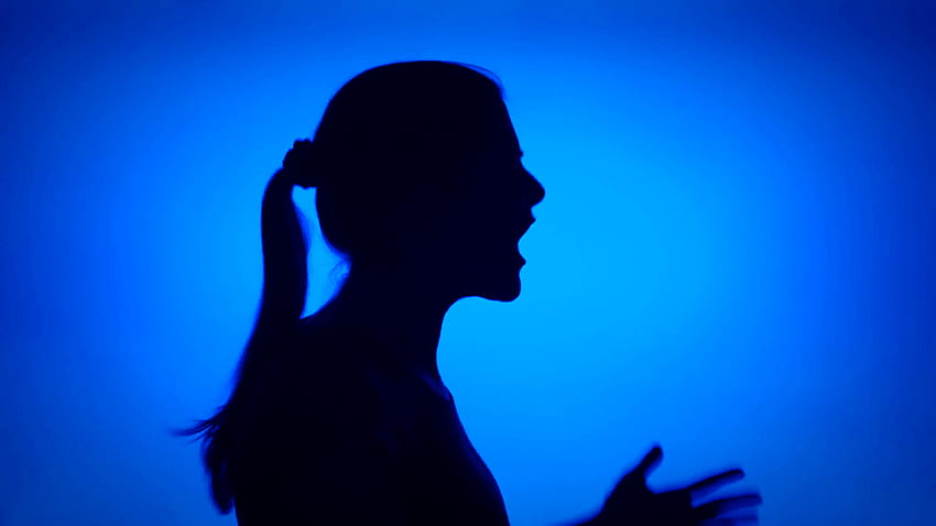 Silhouette of young frustrated woman crying. Female's face in profile screaming in despair on blue background. Black contour shadow of teenager's, furious HD wallpaper