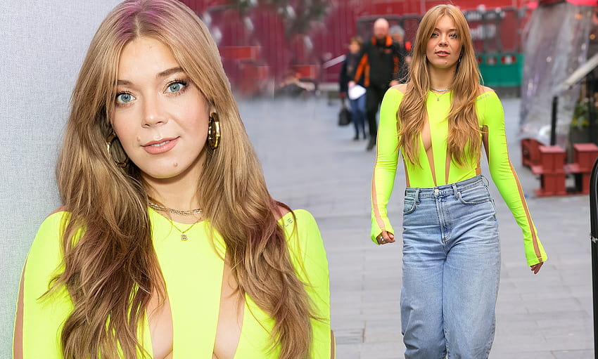 Becky Hill turns heads in skin tight florescent green with racey cut outs and matching heels HD wallpaper