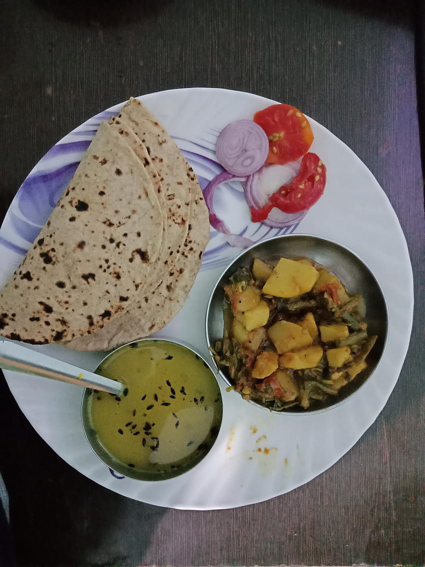 Image of Dal roti, chapati and Sabji on plate isolated with Black  background-RF112161-Picxy