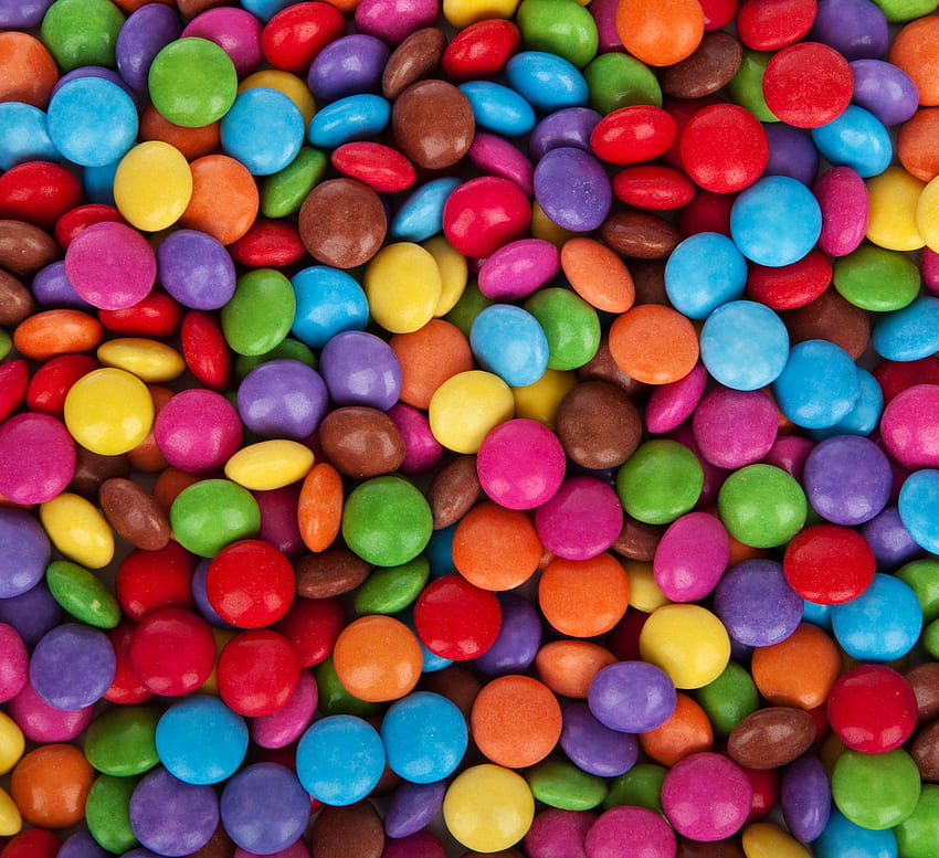 Caramelos de chocolate de colores surtidos, paletas de caramelo fondo de pantalla