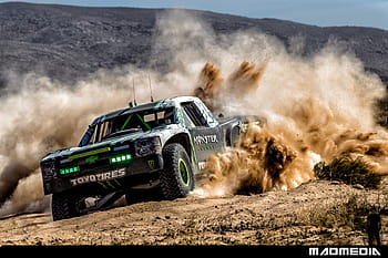 Rocking-across-desert-with-Baldwin,-Monster-Energy-truck