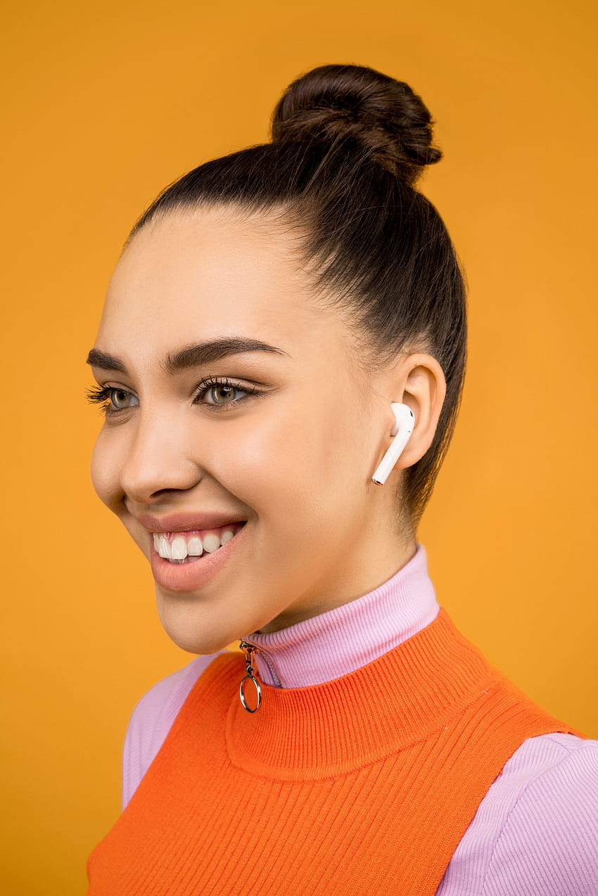 Woman in Pink and Orange Turtleneck Shirt Wearing Airpods · Stock, girl airpods HD phone wallpaper