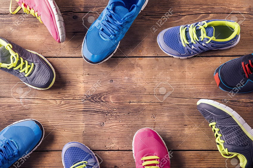 Various Running Shoes Laid On A Wooden Floor Backgrounds Stock [1300x867] for your , Mobile & Tablet HD wallpaper
