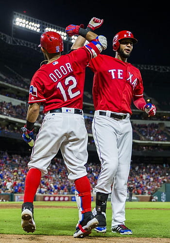 Texas Rangers second baseman Rougned Odor (12) celebrates with Texas  Rangers right fielder Nomar Mazara (30…