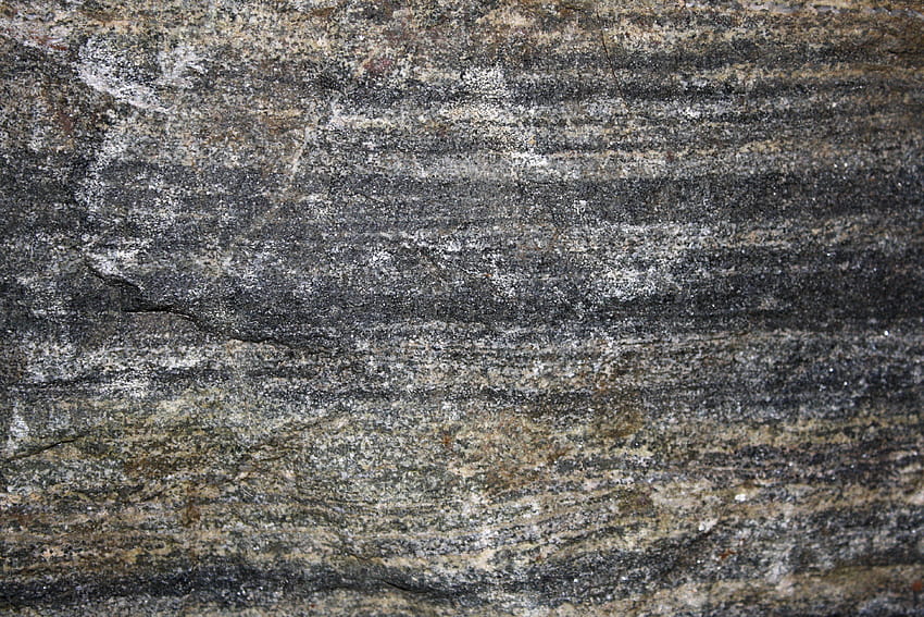Textura de roca de esquisto de mica de biotita en bandas, roca metamórfica fondo de pantalla