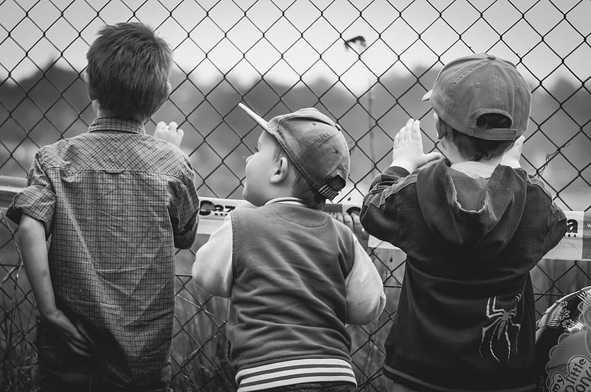 Grayscale graphy of Three Boys Facing Towards Fence · Stock HD wallpaper