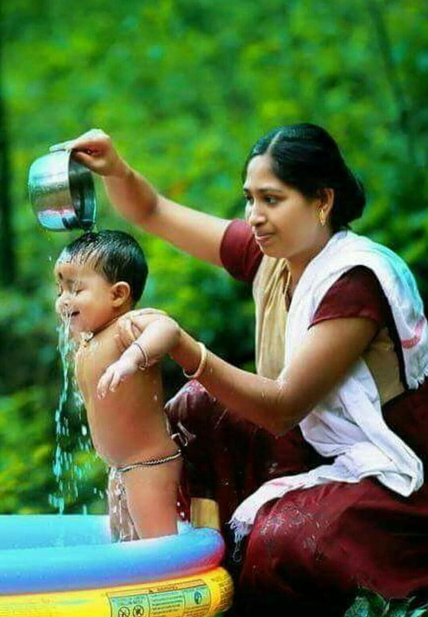 Kerala Woman bathing the child, small baby and mother HD phone ...