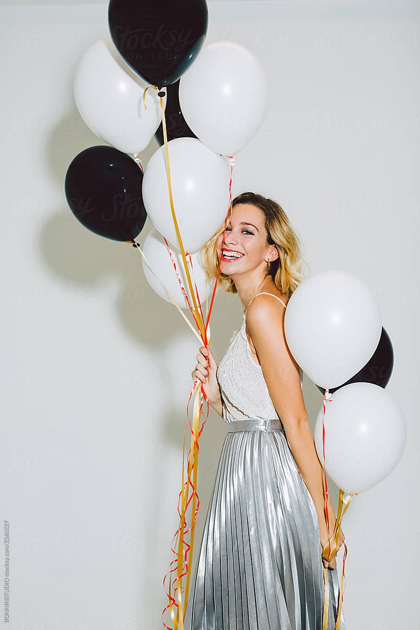 Smiling Beautiful Woman Holding Balloons In A New Year Party Celebration. by BONNINSTUDIO, women carrying balloons HD phone wallpaper