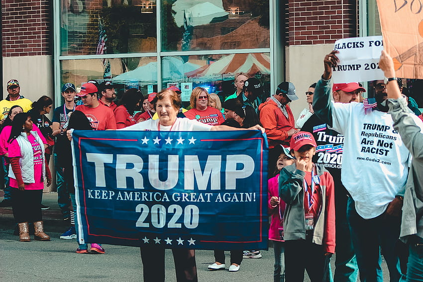 Woman Holding Trump Keep America Great Again 2020 Banner · Stock, trump 2020 flag HD wallpaper