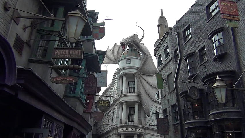 Dragon on the top of Gringotts at Diagon Alley Breathing Fire HD wallpaper