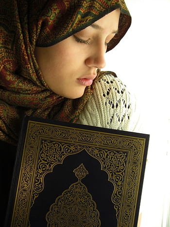 Two Arms of Muslim Girl Hugging Holy Book of Quran Stock Photo - Alamy