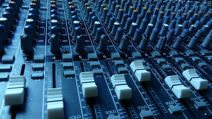 Slide along an audio mixing console. Audio mixer faders and knobs. Music production and sound engineering background. footage. Stock Video Footage HD wallpaper