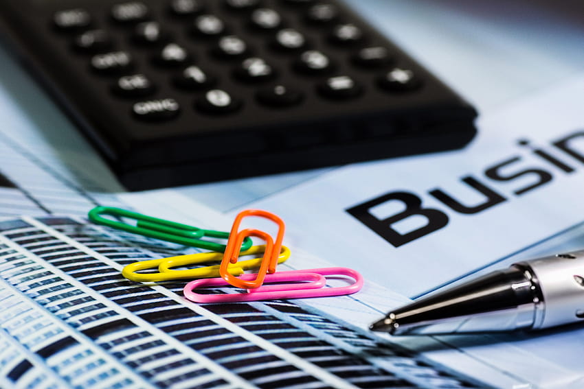 Four Paperclips Next to Silver Ink Pen and Black Calculator · HD