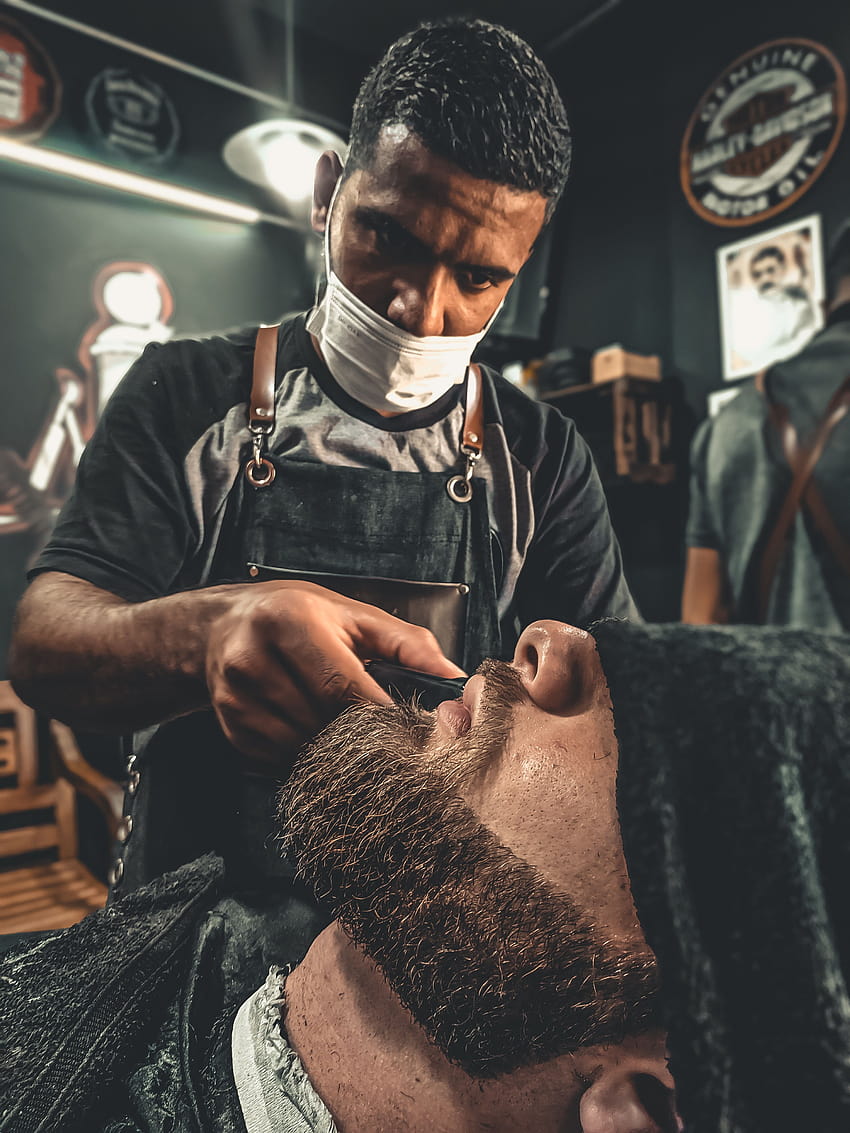 A Barber Grooming A Man's Beard · Stock HD phone wallpaper