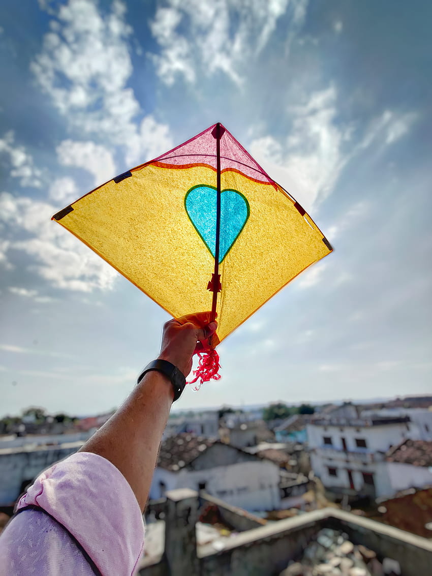 Person Holding A Kite · Stock, kite flying HD phone wallpaper