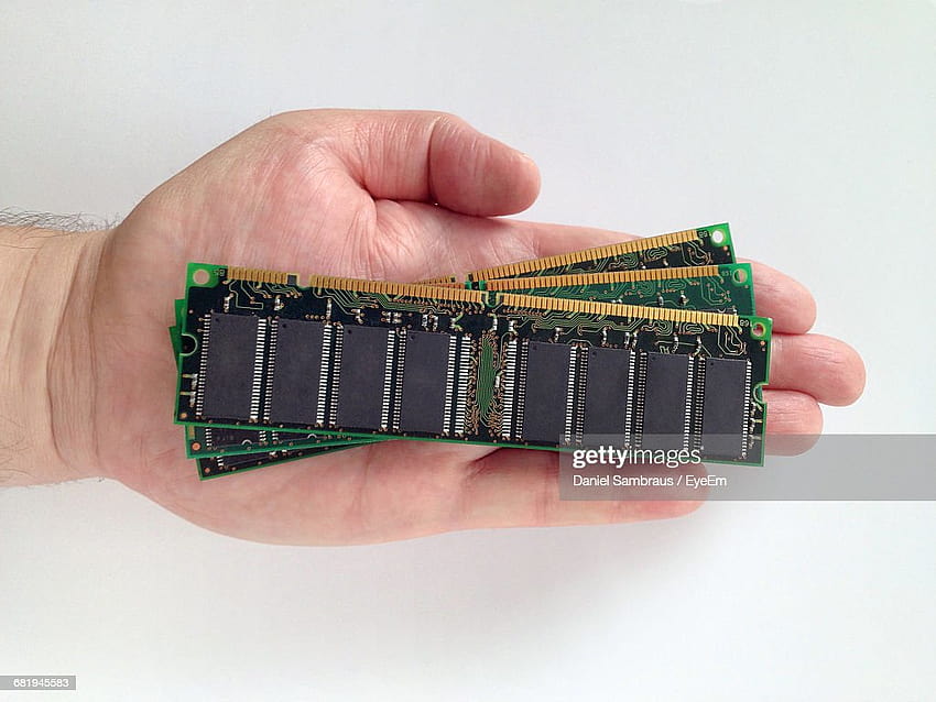 Cropped Hand Of Man Holding Random Access Memories Against White Backgrounds High, random access memory HD wallpaper