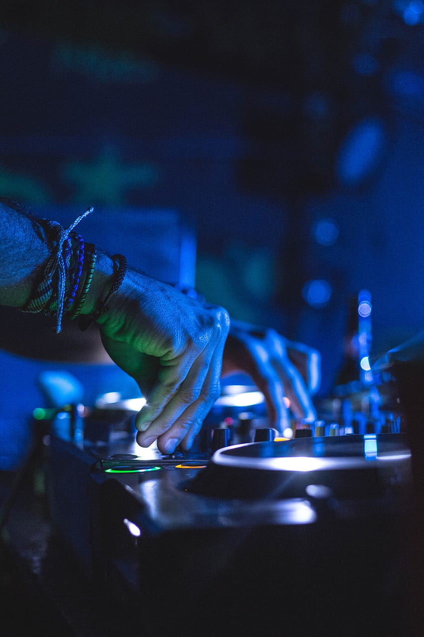 man controlling DJ controller – Miraflores, neon dj HD phone wallpaper