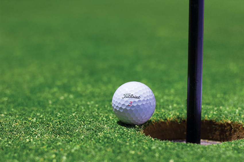 Titrist Golf Ball Near Golf Hole · Stock HD wallpaper