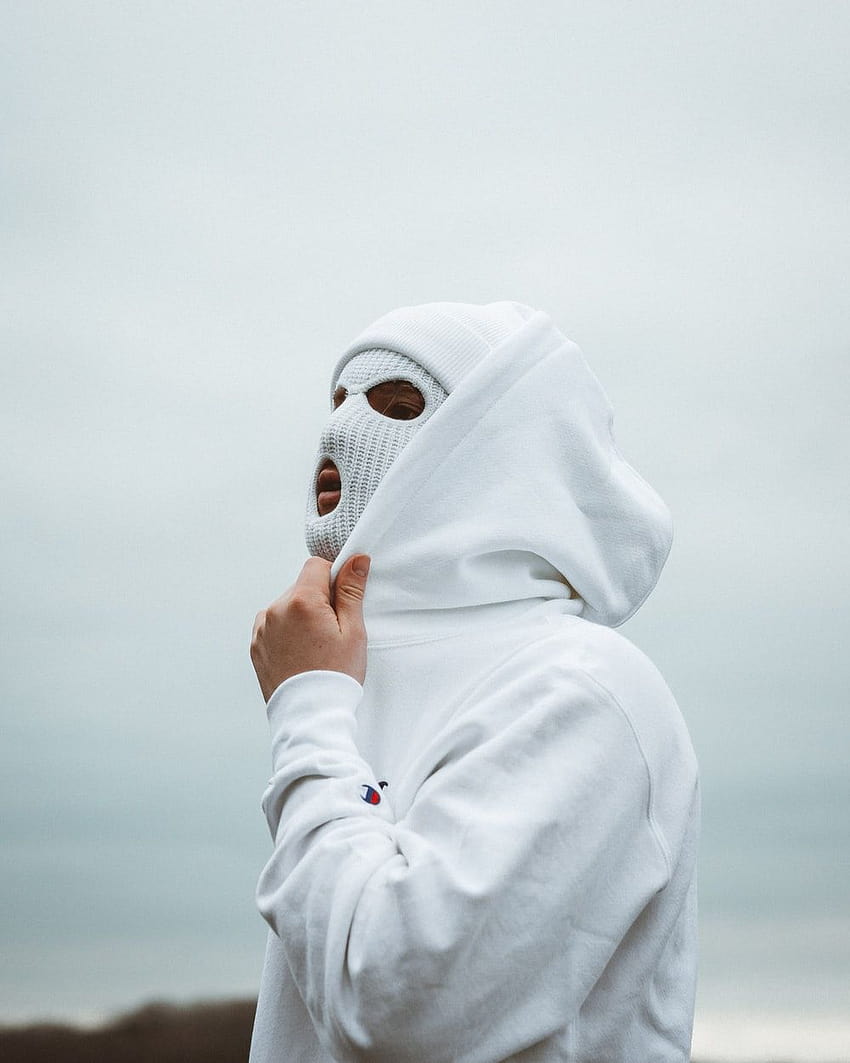 白いヒジャーブで顔を覆っている白いヒジャーブの女性 – オーストリア HD電話の壁紙
