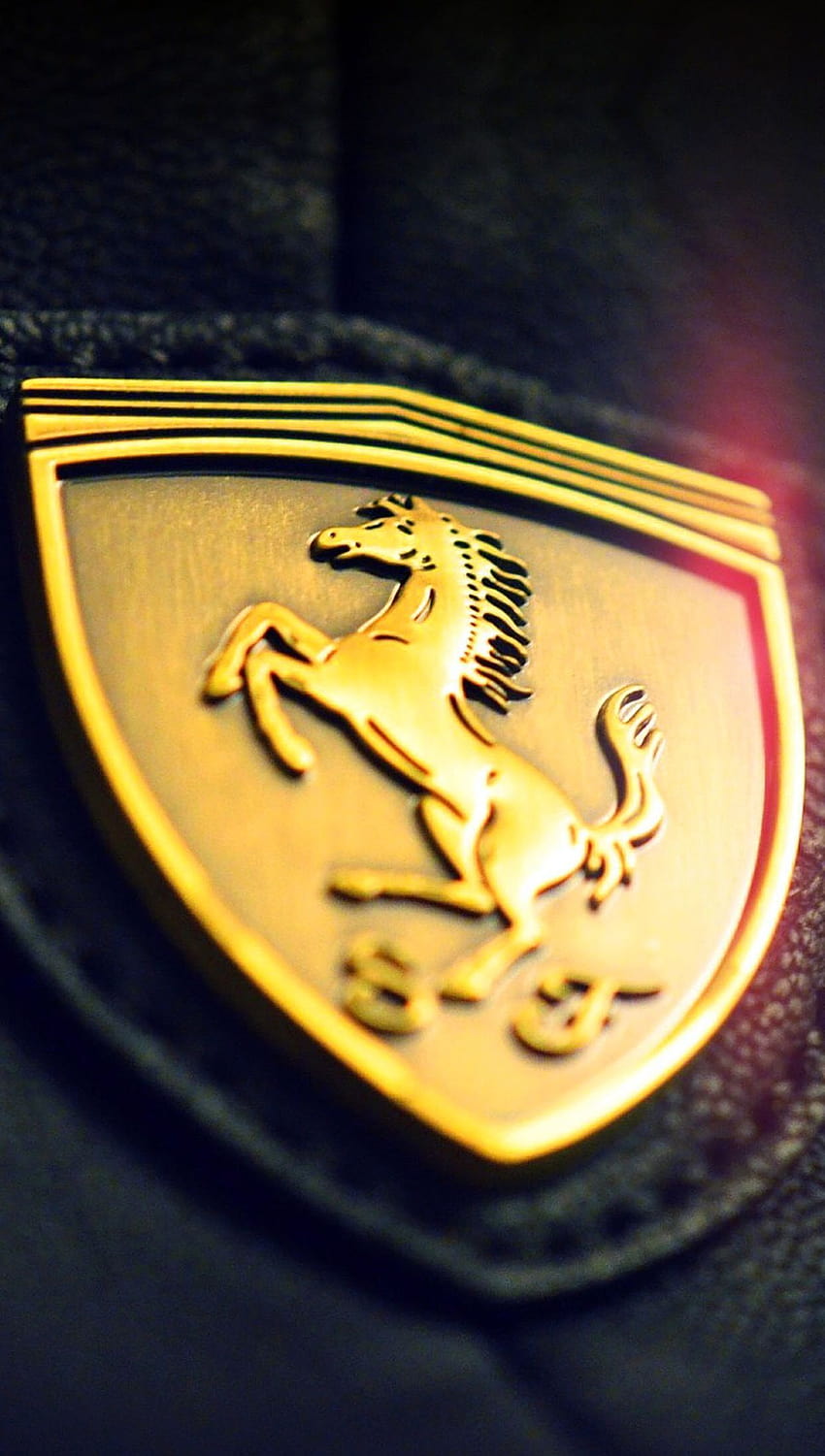 Gold Ferrari logo HD phone wallpaper
