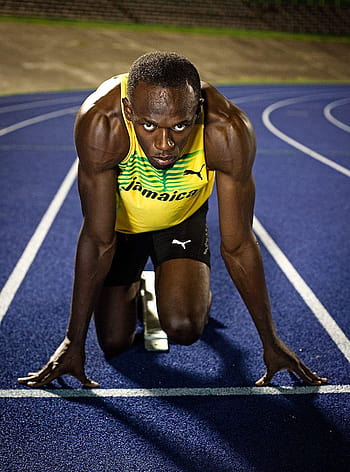 Download Usain Bolt Does His Iconic Pose Wallpaper | Wallpapers.com