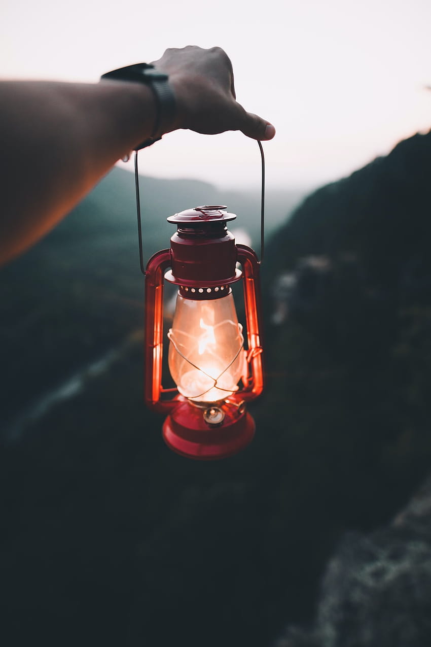 person holding red kerosene lamp – Starr mountain on HD phone wallpaper