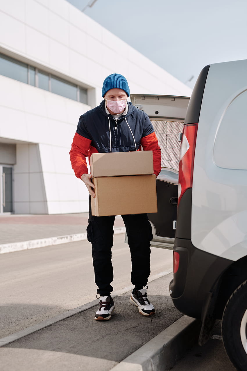 Delivery Man Wearing a Face Mask Carrying Boxes · Stock, courier HD phone wallpaper
