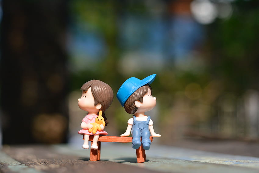 Boy and Girl Sitting on Bench Toy · Stock, share toys HD wallpaper