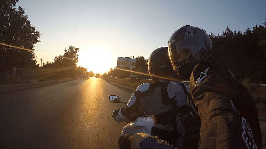 Two man rides on motorcycle at country road in high speed at sunset, biker selfie HD wallpaper