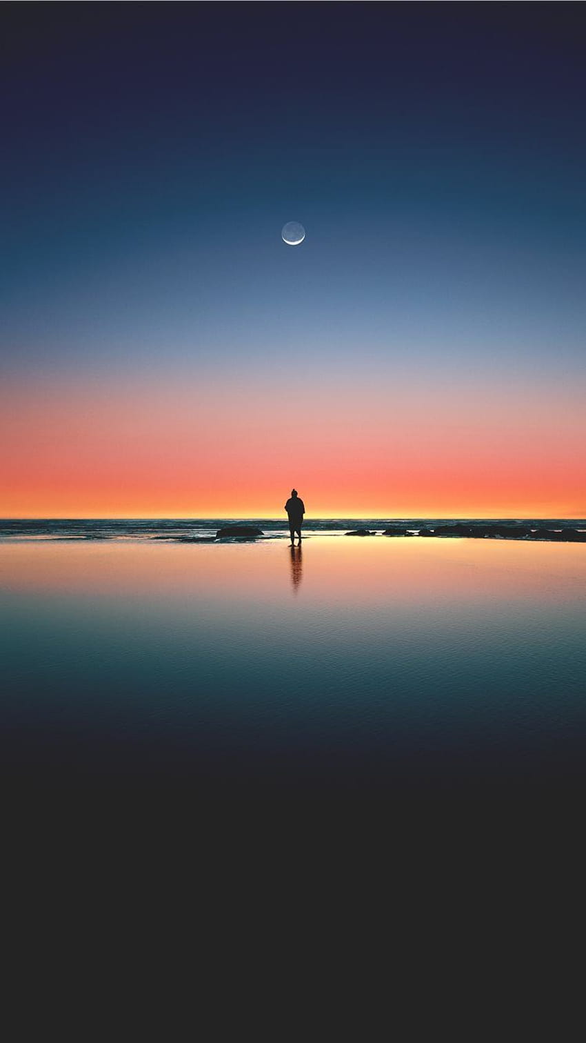 silhouette of man standing on seashore iPhone 8 HD phone wallpaper