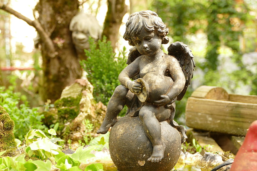 A cherub statue in a garden Ultra HD wallpaper