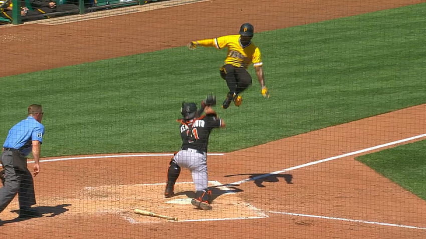 Andrew McCutchen tries hurdling catcher J.T. Realmuto at home plate HD wallpaper