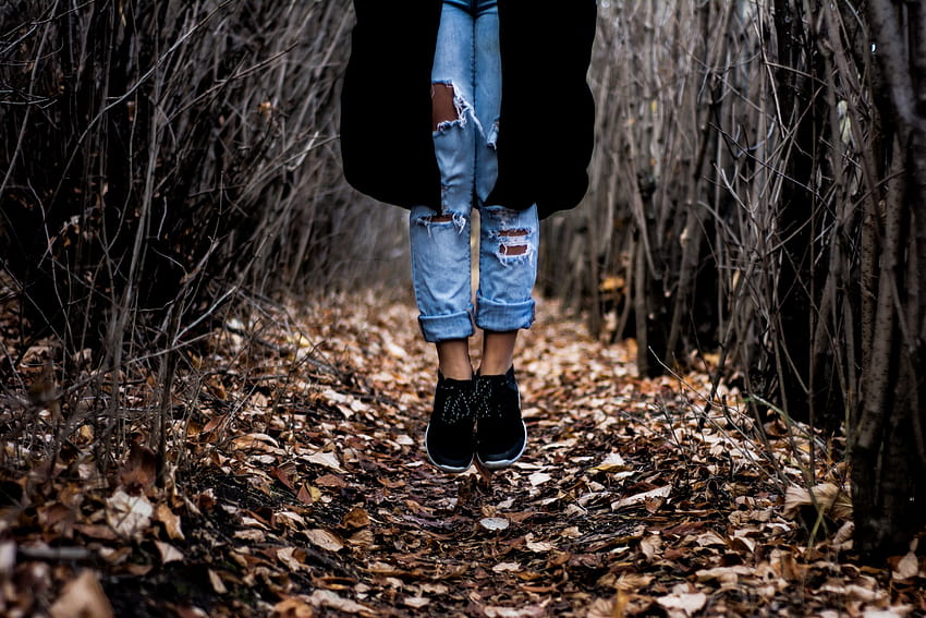 ID: 233146 / a person in ripped jeans jumping up on a carpet of autumn leaves in a thicket, over a leaf covered path HD wallpaper