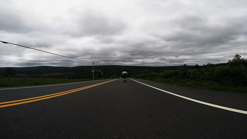 Professional skateboarder skating fast downhill the empty countryside road on longboard on cloudy day, low angle shot Stock Video Footage, longboard downhill HD wallpaper