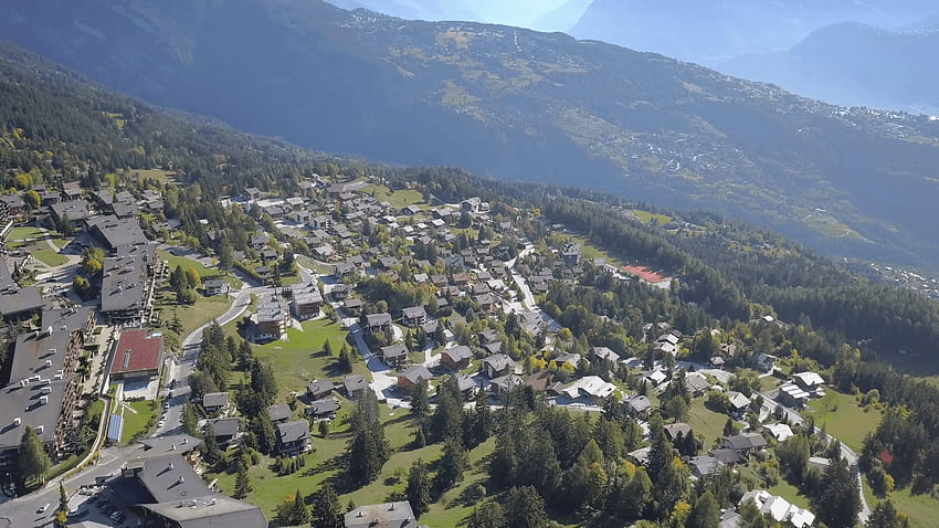 Anzere mountain resort Switzerland. Cinematic aerial shot, little, little village in the alps HD wallpaper