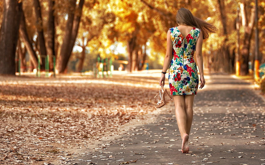 women's red, white, and green sleeveless dress, woman wearing floral dress walking in gray pavement road in between b…, walking women HD wallpaper